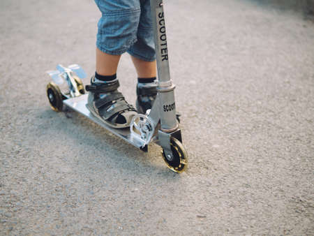 Baby boy on scooterの写真素材