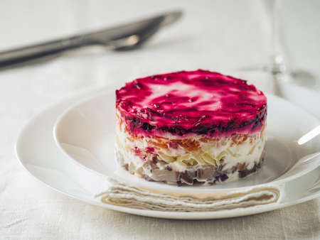 Salad herring under fur coat on festive plate