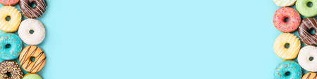 donuts on blue background, top viewの写真素材