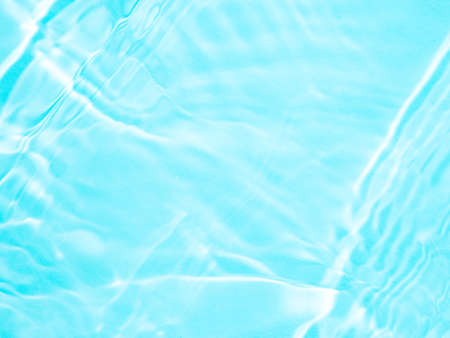 Ripple water texture with shadows on blueの写真素材