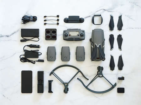 Set of folding drone or quadcopter with many accessories, top view or flat lay. Kit of folding drone...