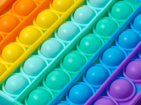 Popit extreme closeup. Popular silicone colorful antistress pop it toy for child. Simple dimple....