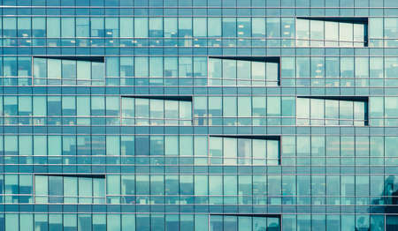 Modern building exterior with copy space. Modern office building with facade of glass.の写真素材
