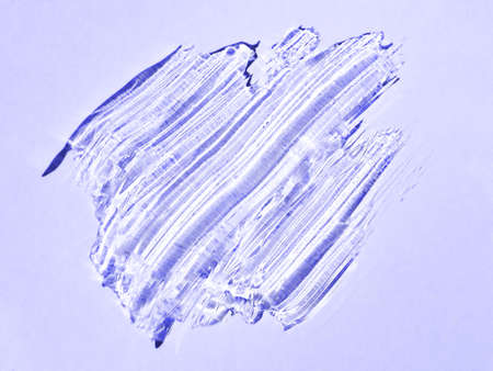 Liquid gel cosmetic diagonal smudge on violet purple background in color of 2022 year very peri. Aesthetic beautiful textured smears skin gel, flat lay. Demonstrating color of 2022 year in cosmetologyの写真素材