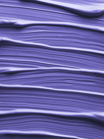 Aesthetic cosmetic texture in violet color of 2022 year very peri.. Liquid natural cosmetic for female face makeup. Abstract background brush strokes of purplecream. Demonstrating color of 2022 yearの写真素材