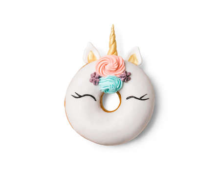 Unicorn donut isolated on white background. Trendy donut unicorn with white glaze. Top view or flat layの写真素材