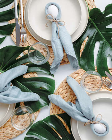 Tropical Easter Tablesetting. Top view of table setting for Christian Easter with bunny eggs...