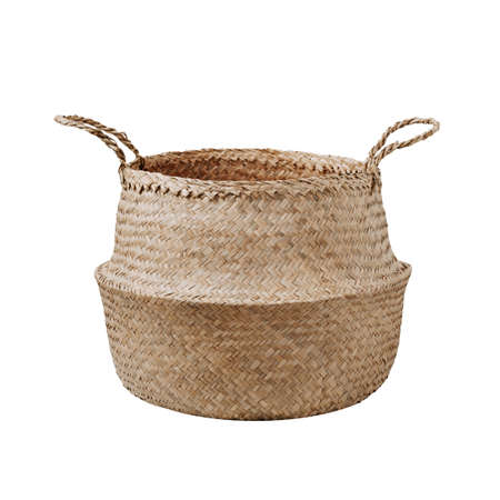 Empty trendy design handwoven seagrass belly basket with handles for storage laundry and toys or can use as cachepot. Round storage basket in braided seagrass, isolated on white background with clipping pathの写真素材