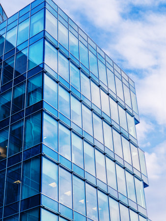 Modern building exterior with copy space. Modern office building with facade of glass.の写真素材