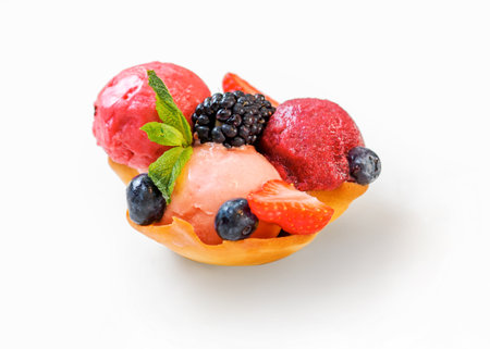 Berry sorbet with three flavors - strawberry, raspberry, black currant. Scoop ice cream sorbet decorated fresh berries and mint. Summer ice cream conceptの写真素材