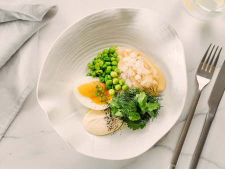 Aspic or Kholodets. Smoked carp aspic served with greens and pike caviar. White chicken meat or fish in aspic with vegetables. Tasty fish or meat in jelly gelatin. Top view. Delicious food backgroundの写真素材