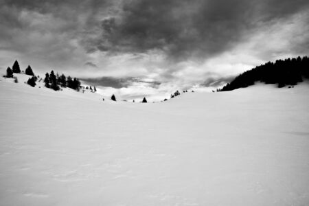 threatening clouds on the saddle of Porta Manazzo near Cima Larici on the Asiago plateau, Vicenza, Italyの写真素材