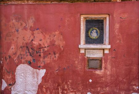 icon set on red wall in Venice, Italyの写真素材