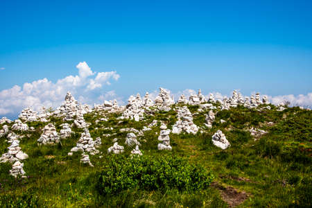 Cairn on the tops of the Venetian pre-Alps on the chain of Mount Baldo on Lake Garda, Malcesine,...