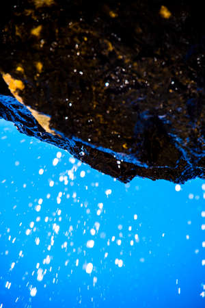 pure water drops are sprayed from the waterfalls in the springs of Val Travenanzes in the Dolomites of Cortina D'ampezzo in Belluno, Veneto, Italyの写真素材