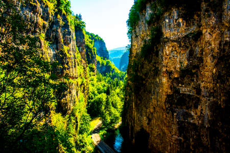 canyon with walkway carved into the rock at the Sanctuary of San Romedio a Fondo, in the Val di Non, in Trento, Italyの写真素材