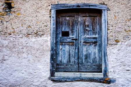 ancient wooden doors of the Tabia family in Fornesighe, in the Zoldo valley, Belluno Italyの写真素材