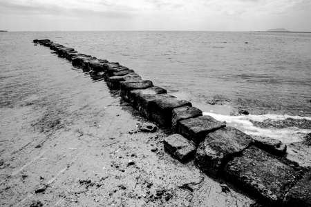 ancient stone jetty at the Laguna dello Stagnone Marsala Trapani Sicily Italyの写真素材