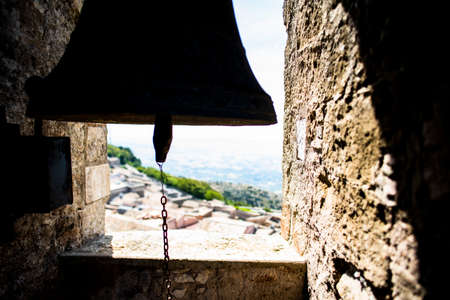 silhouette of a bell perched on the tower of n campanile in Erice Trapani Sicily Italyの写真素材