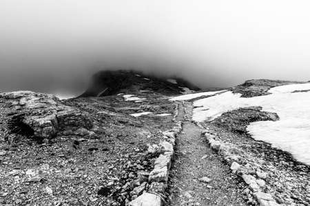 clouds surround the beautiful dolomites around San Martino di Castrozza and Passo Rolle Trento Italysurroundの写真素材