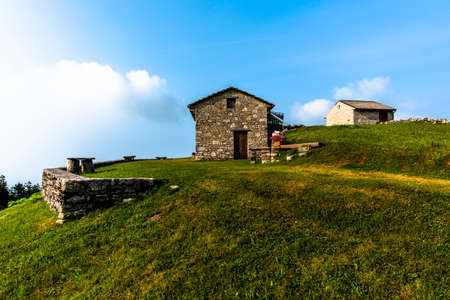stone shelter among the green meadows on the mountains above Revine Lago Treviso Veneto Italyのeditorial素材