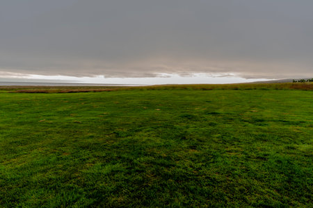 sunrise over the meadows in Northern Iceland at 66 parallel to Tjornes near Husavik in the Municipality of Nordurping in Icelandの写真素材