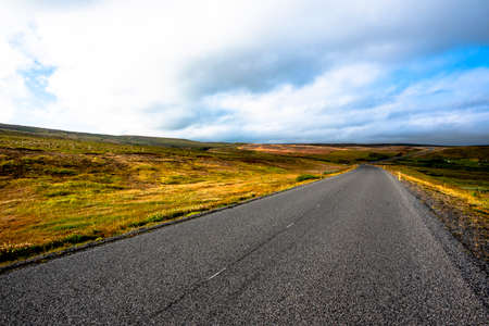 road through the lava meadows on Lake Myvatn near Husavik in the municipality of Nordurping in Icelandの写真素材