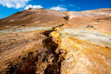 Namaskard in the Krafla volcano system and is located east of Lake Myvatn with pools of molten rock bubbling in a landscape where yellow and red hues prevailの写真素材