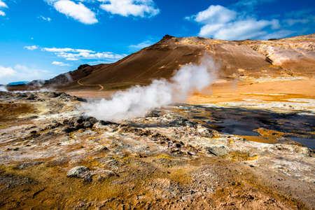 Namaskard in the Krafla volcano system and is located east of Lake Myvatn with pools of molten rock bubbling in a landscape where yellow and red hues prevailの写真素材
