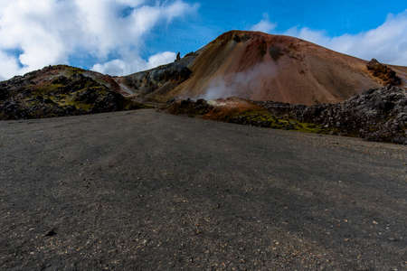 the multicolored rhyolite mountains, vast expanses of lava and hot springs in the Landmannalaugar park mountainous region near the Hekla volcano in southern Icelandの写真素材
