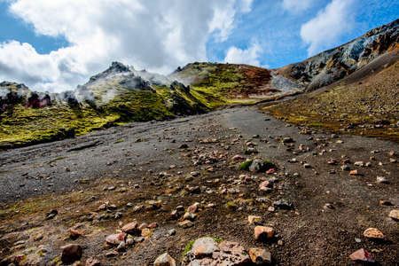 the multicolored rhyolite mountains, vast expanses of lava and hot springs in the Landmannalaugar park mountainous region near the Hekla volcano in southern Icelandの写真素材