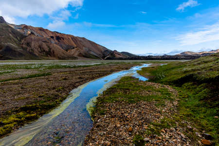 the multicolored rhyolite mountains, vast expanses of lava and hot springs in the Landmannalaugar park mountainous region near the Hekla volcano in southern Icelandの写真素材