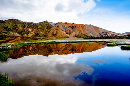 the multicolored rhyolite mountains, vast expanses of lava and hot springs in the Landmannalaugar park mountainous region near the Hekla volcano in southern Icelandの写真素材