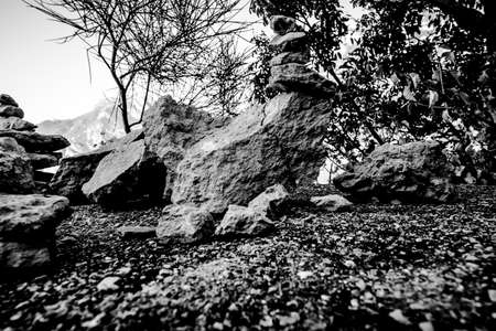 stack of angular stones balanced like cairns on the path to Torbole sul Garda Trento