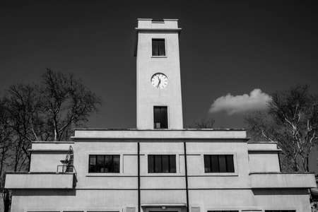 tower with clock architectural construction with clock 40s italy vintage building with blue sky