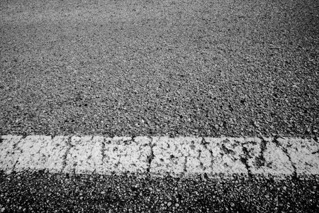 asphalt with white line drawn conceptual photography in Orgiano Vicenza Veneto Italyの写真素材