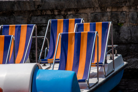striped deckchair on the pedalo in Garda on Lake Gardaの写真素材
