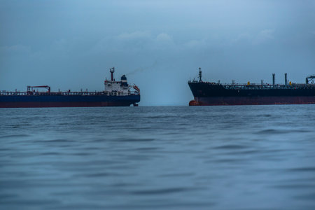 ocean with two ships queuing to enter the port of Paracas Peruの写真素材