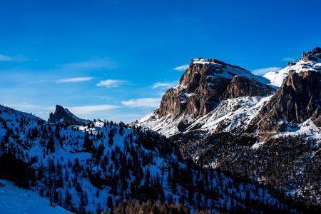 snowy landscape of the Belluno Alps among the Dolomites of Cortina d Ampezzo blue sky among the Dolomite peaks in Bellunoの写真素材