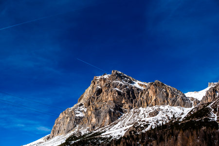 snowy landscape of the Belluno Alps among the Dolomites of Cortina d Ampezzo blue sky among the Dolomite peaks in Bellunoの写真素材