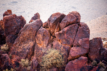 orange volcanic rocks and desert Atlas panorama in the mountains in the heights near Jebel Saghro between the desert and Marrakesh in Moroccoの写真素材