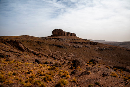 panorama of the Moroccan Atlas mountain peaks with desert valleys and orange rocks among the Berber trails in Jebel Saghro near Ouarzazate Marrakech in Moroccoの写真素材