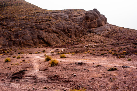 panorama of the Moroccan Atlas mountain peaks with desert valleys and orange rocks among the Berber trails in Jebel Saghro near Ouarzazate Marrakech in Moroccoの写真素材