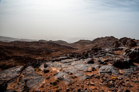 rocky trail between the mountain peaks of the Moroccan Atlas with desert valleys among the Berber lands in Jebel Saghro near Ouarzazate in Marrakech in Moroccorocky trail between the mountain peaks of the Moroccan Atlas with desert valleys among the Berber lands in Jebel Saghro near Ouarzazate in Marrakech in Moroccoの写真素材
