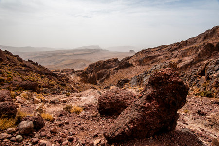 rocky trail between the mountain peaks of the Moroccan Atlas with desert valleys among the Berber...