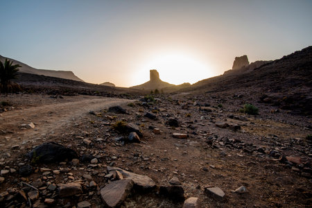 beautiful view of Bab N Ali at sunset with the mountains and orange rocks of the Id Bab N Ali is a geological site located in the Zagora region near Ourzazate Marrakesh Moroccoの写真素材