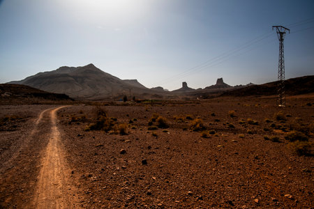 beautiful view of Bab N Ali at sunset with the mountains and orange rocks of the Id Bab N Ali is a geological site located in the Zagora region near Ourzazate Marrakesh Moroccoの写真素材