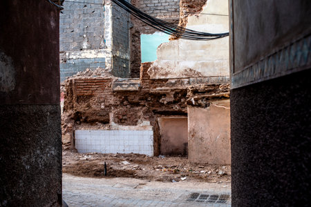 house rubble after marrakech earthquake in late afternoon with white tiles on your back and...