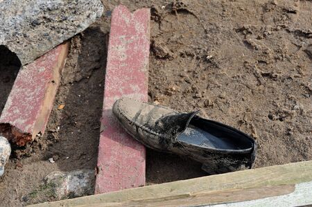BROOKLYN, NY - NOVEMBER 01: Abandoned mens shoe at the Seagate neighborhood due to impact from Hurricane Sandy in Brooklyn, New York, U.S., on Thursday, November 01, 2012.  
のeditorial素材