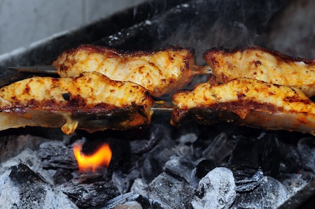 grilled fish kebab, sea bass on coils